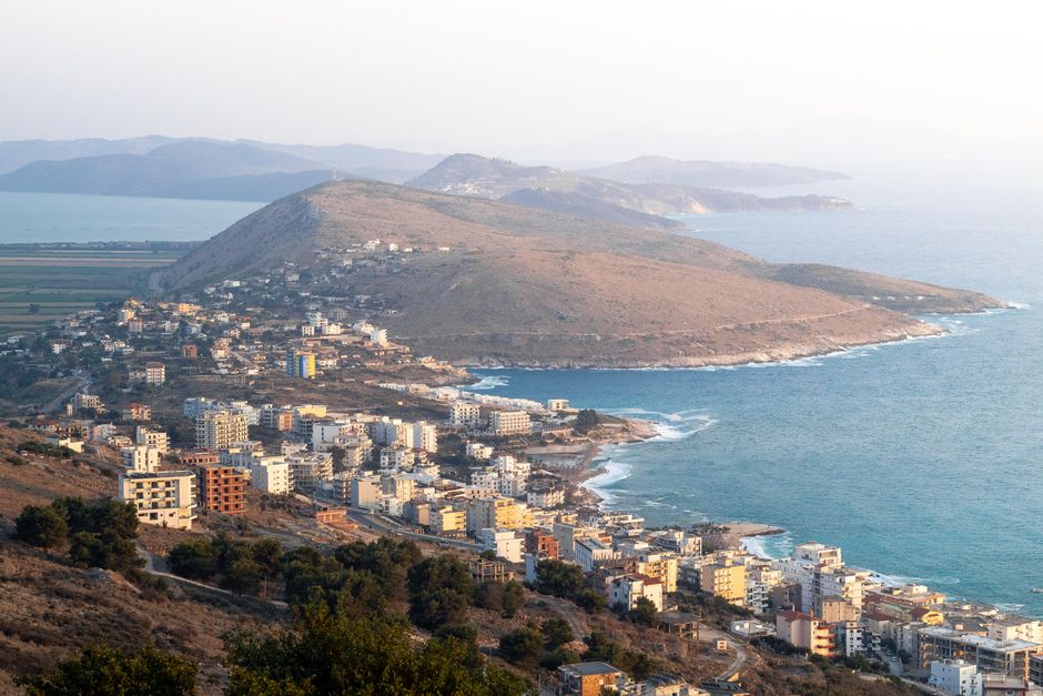 Saranda coastline at dusk with Lëkurësi Castle
